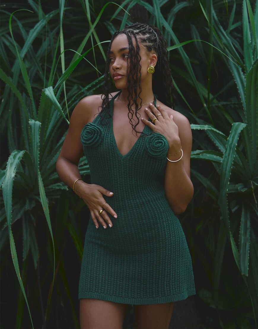 Loz Vassallo wearing green mini dress with corsage detail