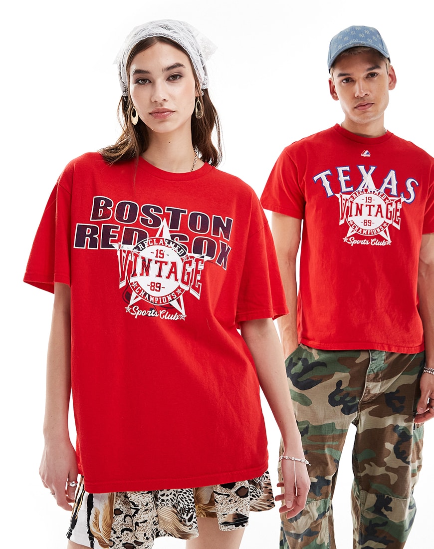 Man and woman wearing red slogan T-shirts standing beside each other