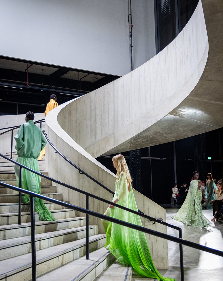 Tate Modern staircase with models walking on it in colourful clothes
