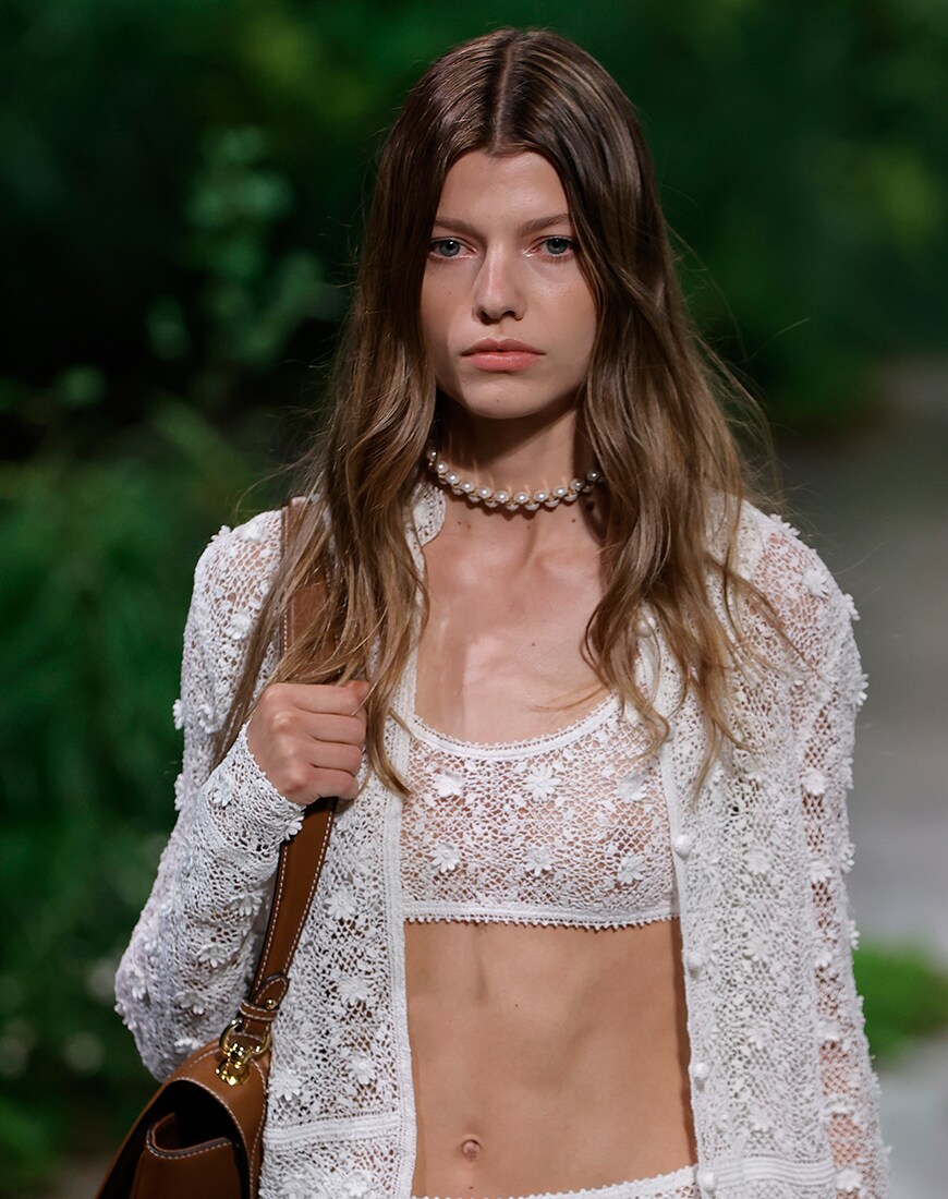Woman wearing sheer white duo set