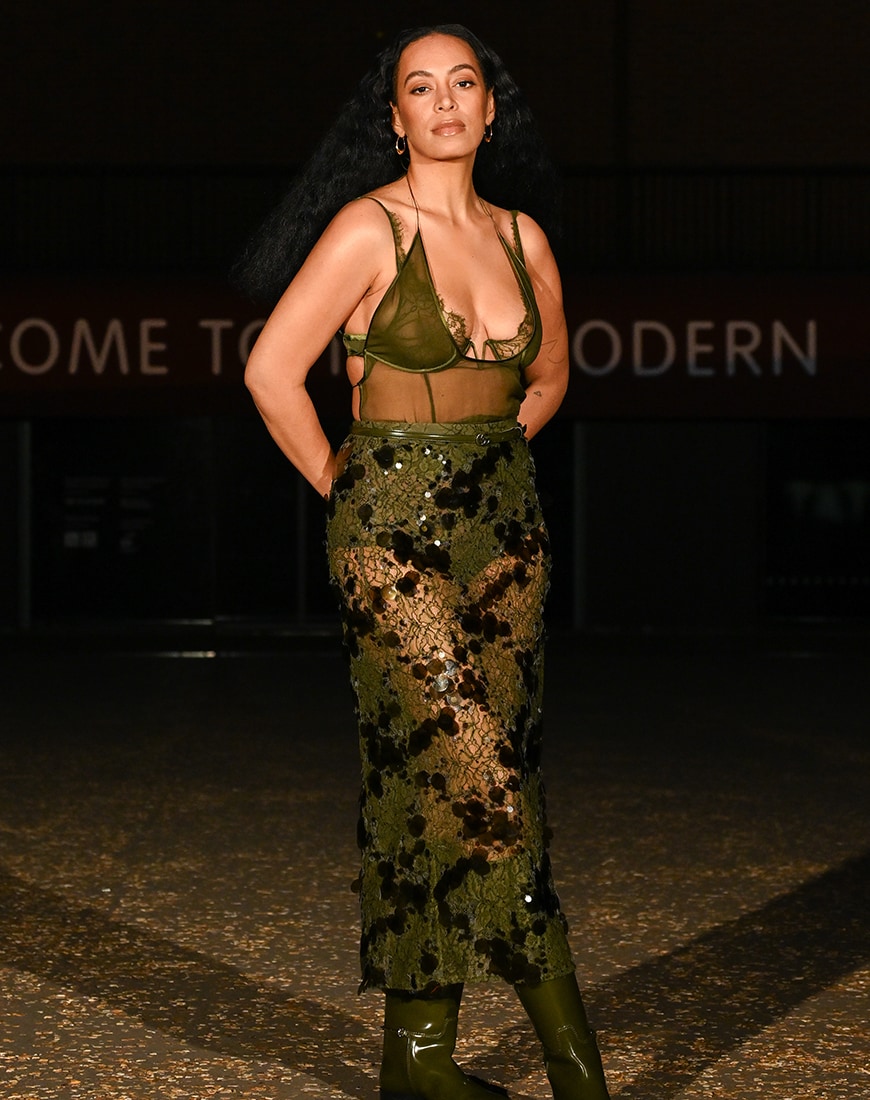 Solange Knowles wearing Gucci khaki lace bralette with briefs and lace skirts over