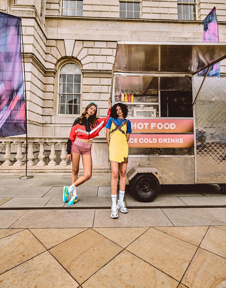 Models standing by a food truck wearing festival outfits | ASOS Style Feed