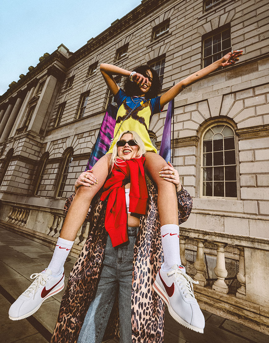 Model sitting on another model's shoulders wearing festival outfits| ASOS Style Feed