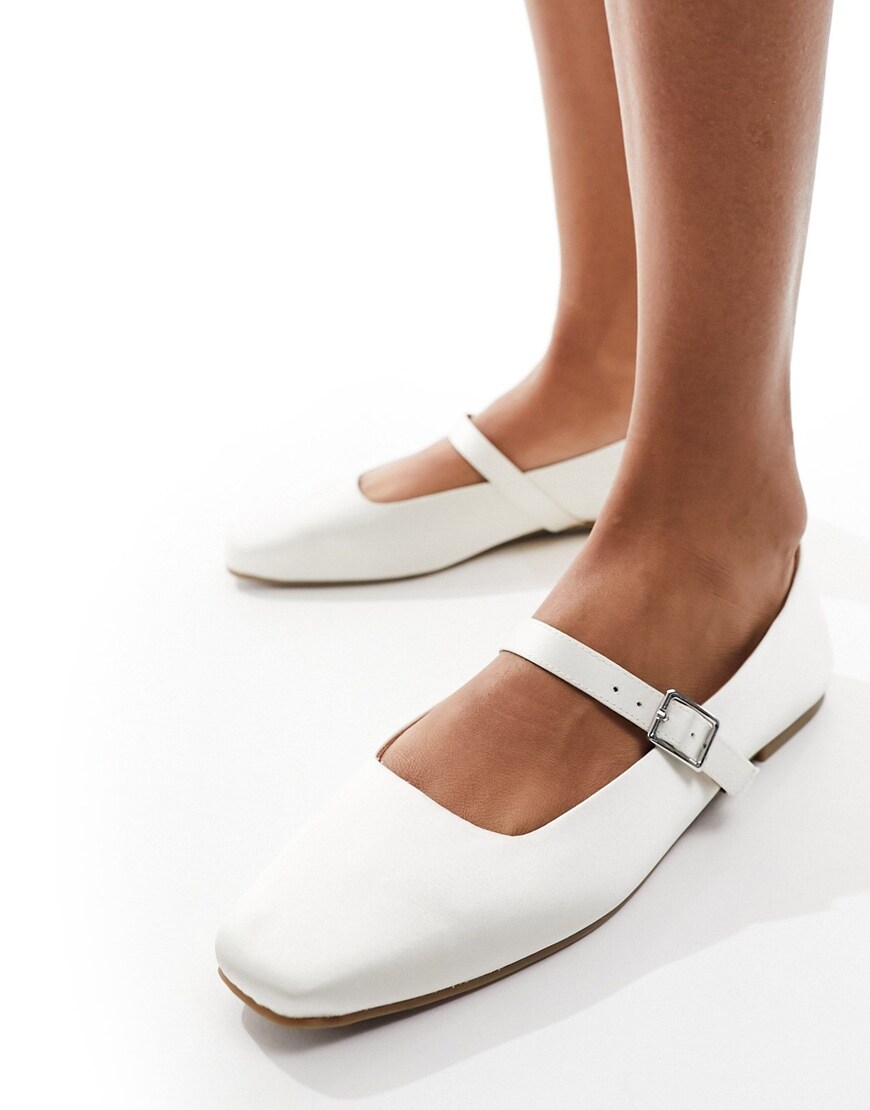 Person wearing ASOS DESIGN Lottie Mary Jane ballet in Ivory