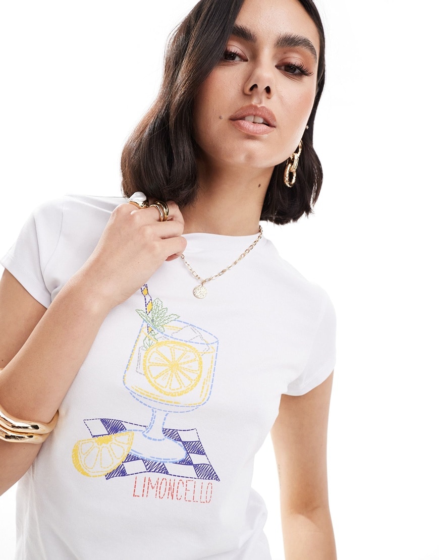Person wearing ASOS DESIGN baby tee with limoncello drink graphic in white