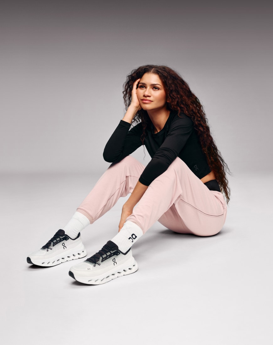 Zendaya wearing black jumper and pink joggers | ASOS Style Feed