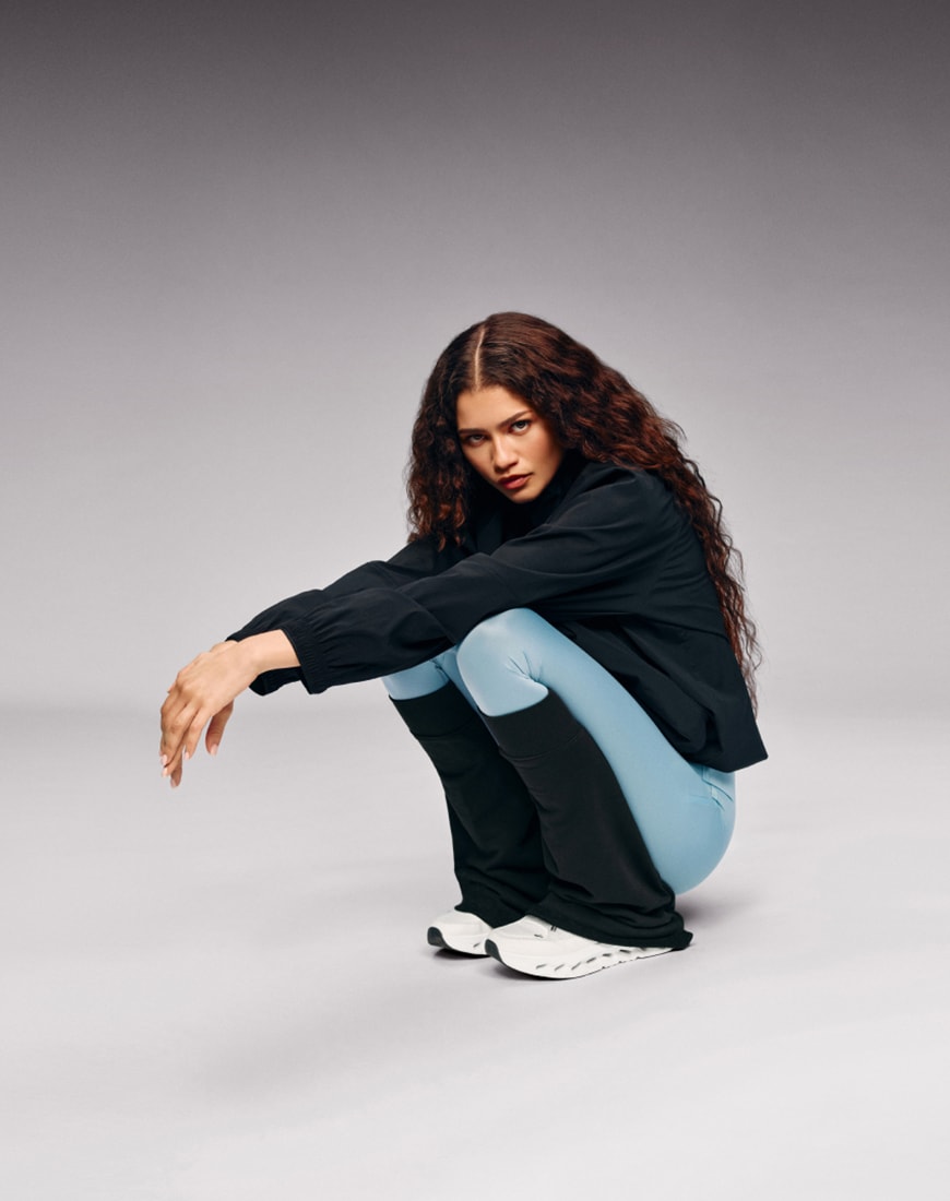 Zendaya wearing black leg warmers with blue joggers