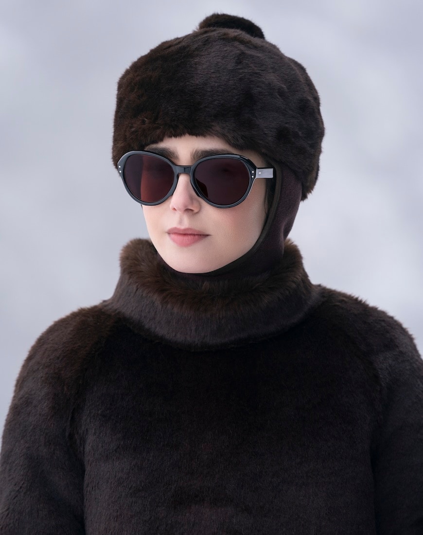 Emily in a fur hat and shades