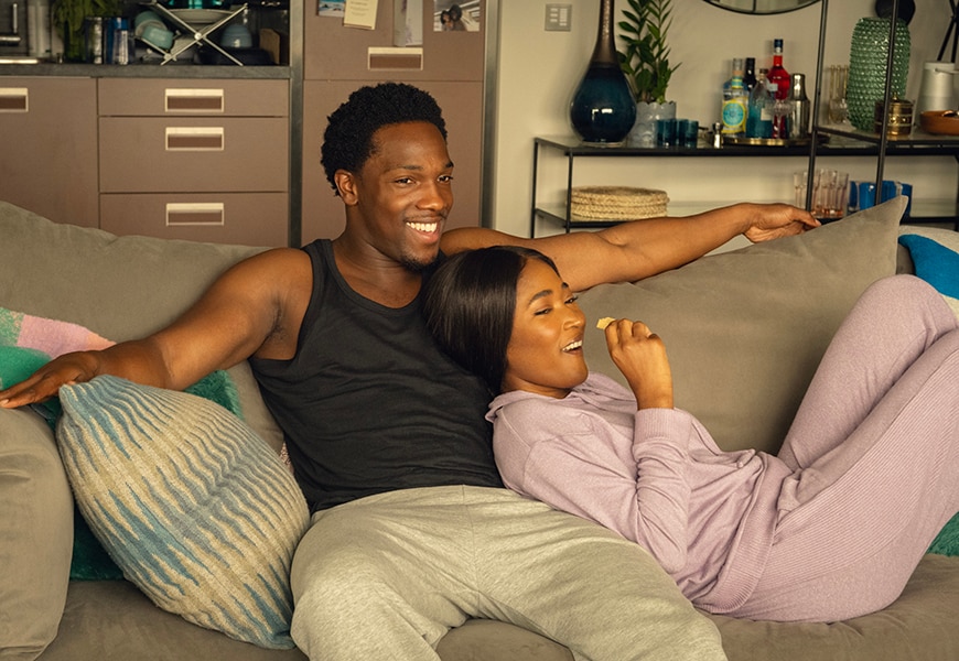 Dionne and Michael on the sofa in Netflix's Supacell. | ASOS Style Feed