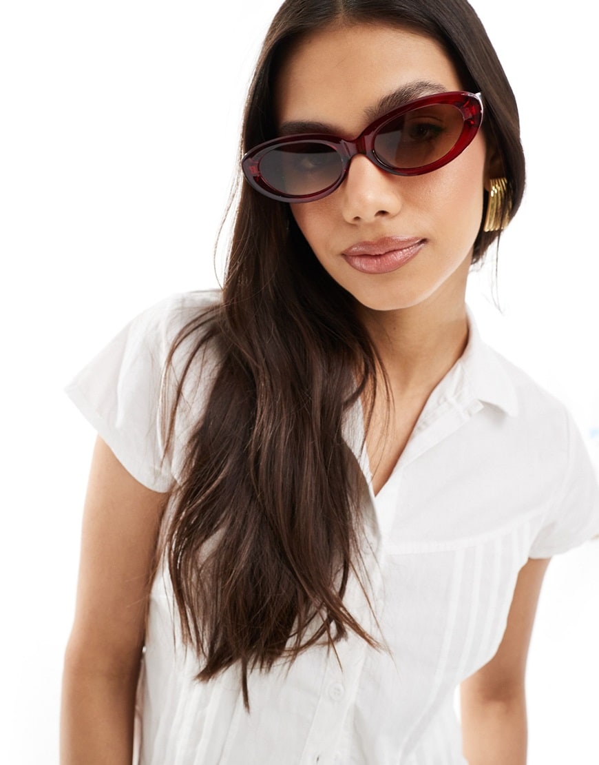 ASOS DESIGN oval sunglasses in crystal red