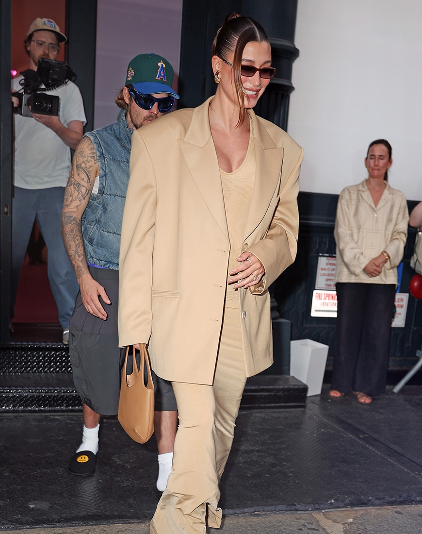 Hailey Bieber wearing tan dress and tan oversized blazer