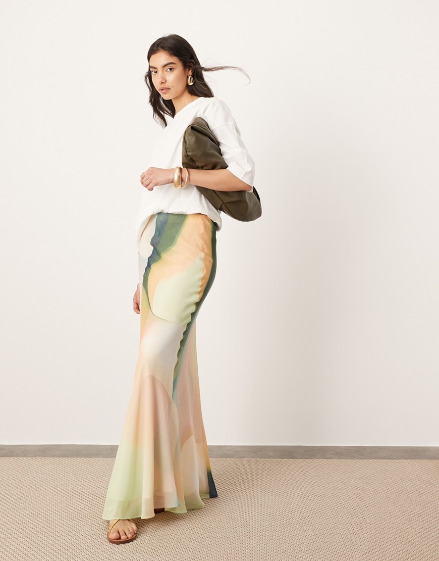 Model wearing maxi skirt and white t shirt