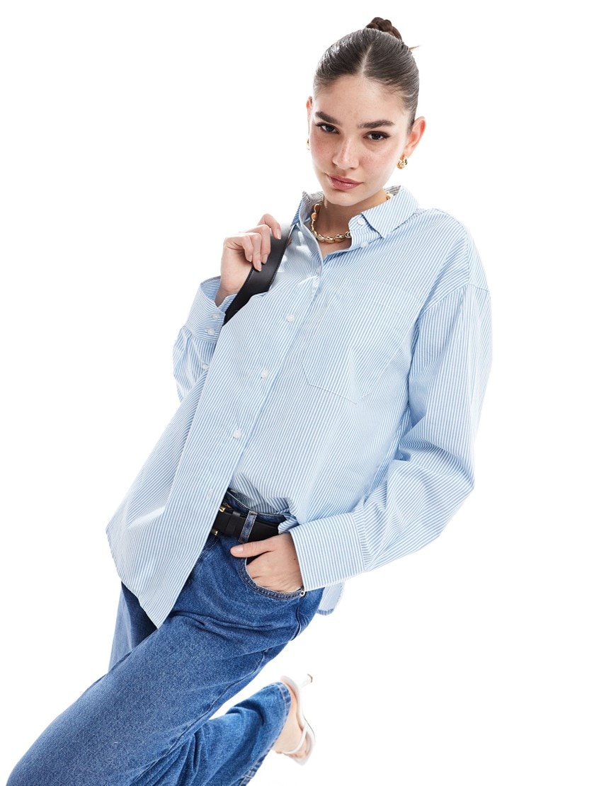 Model wearing blue oversized linen shirt