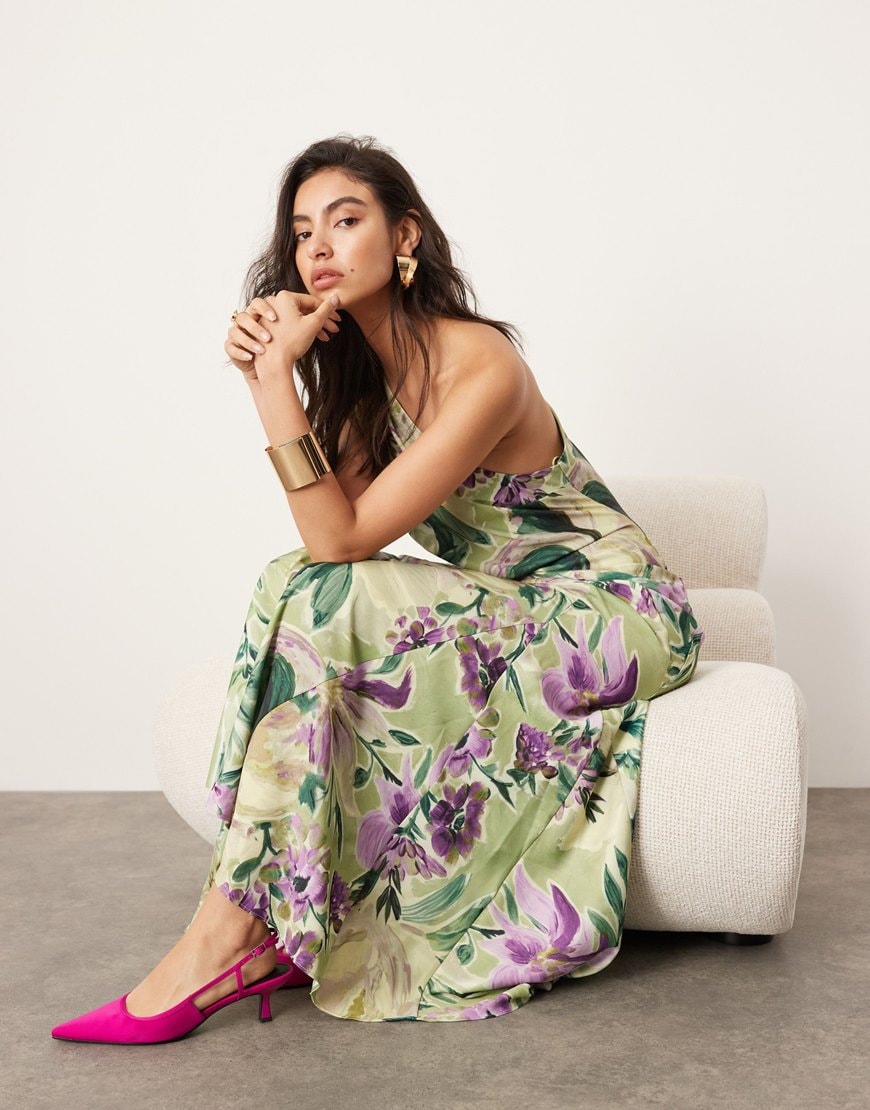 A woman wearing a green and purple floral maxi dress | ASOS Style Feed