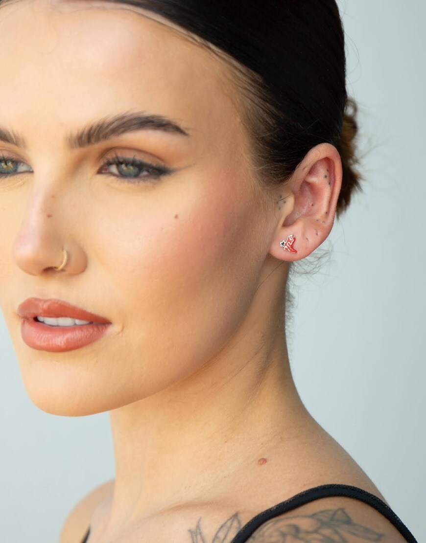 Sophie Floyd wearing enamel western earrings