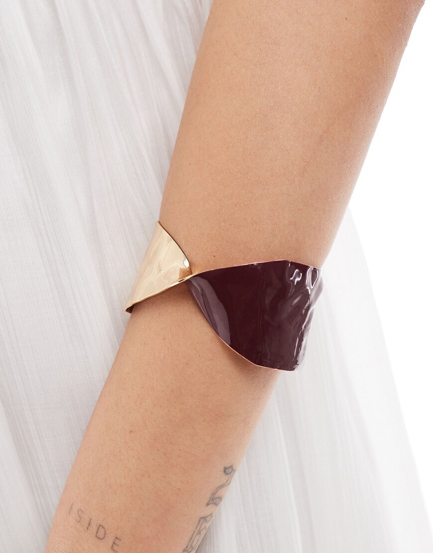 A model wearing a gold-tone and enamel bracelet | ASOS Style Feed