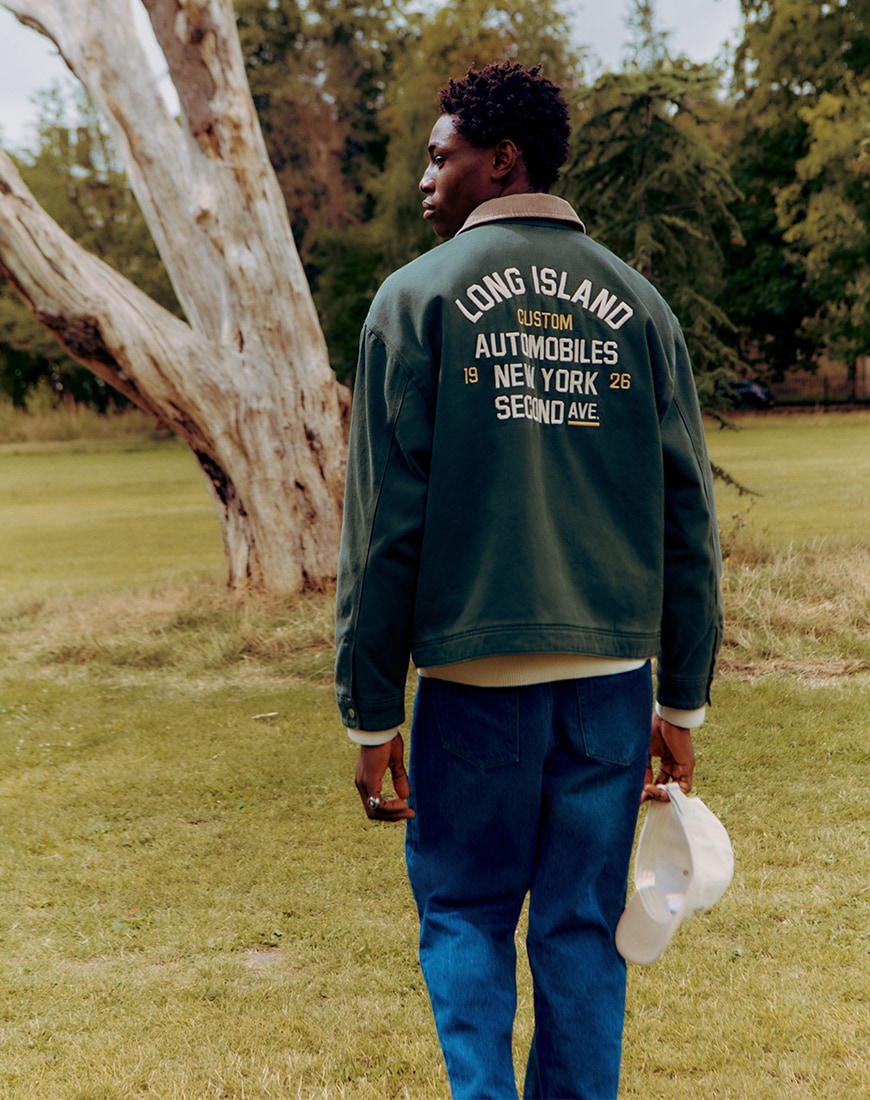 A man wearing a green jacket in the park | ASOS Style Feed
