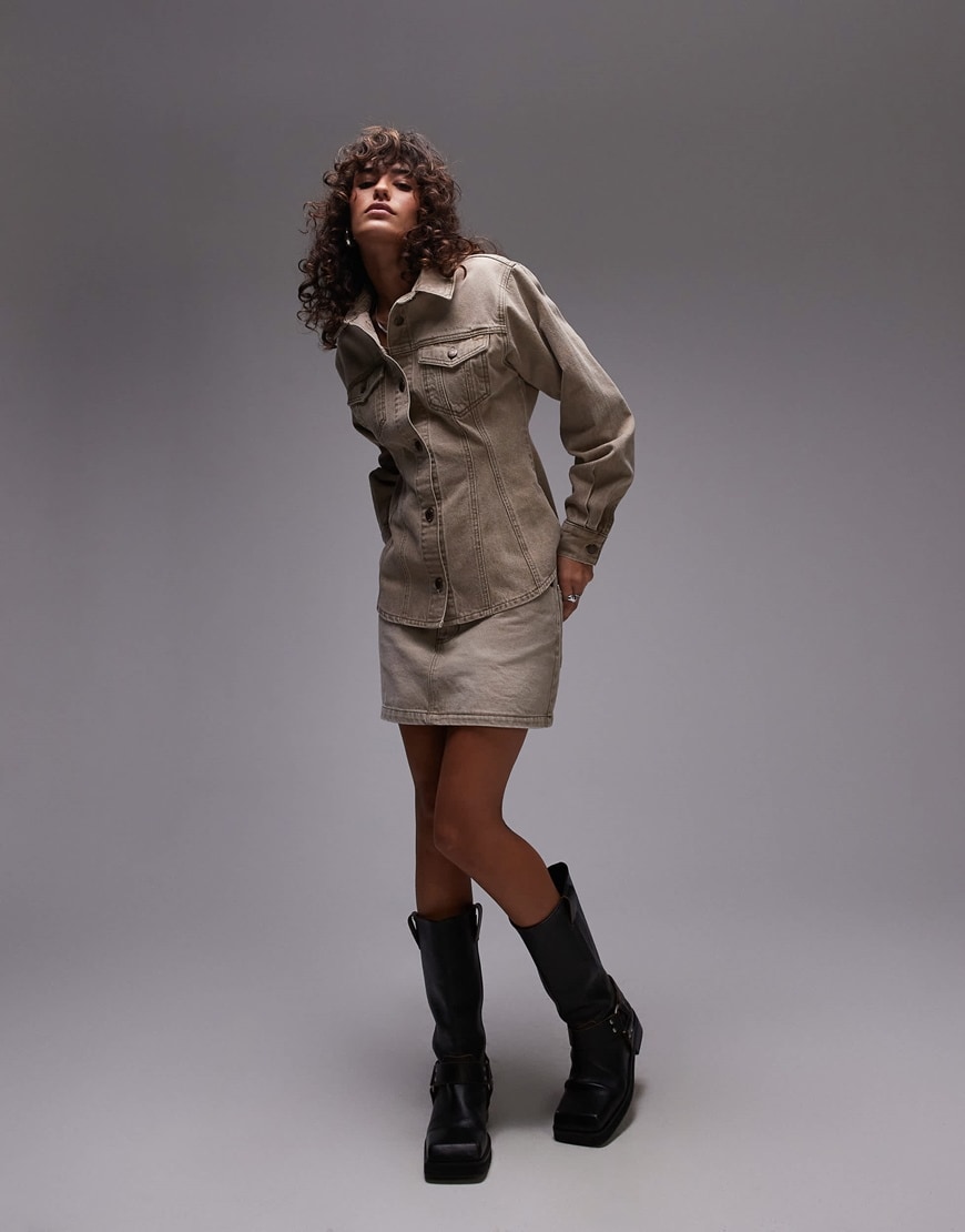 Model wearing beige denim jacket and skirt co-ord
