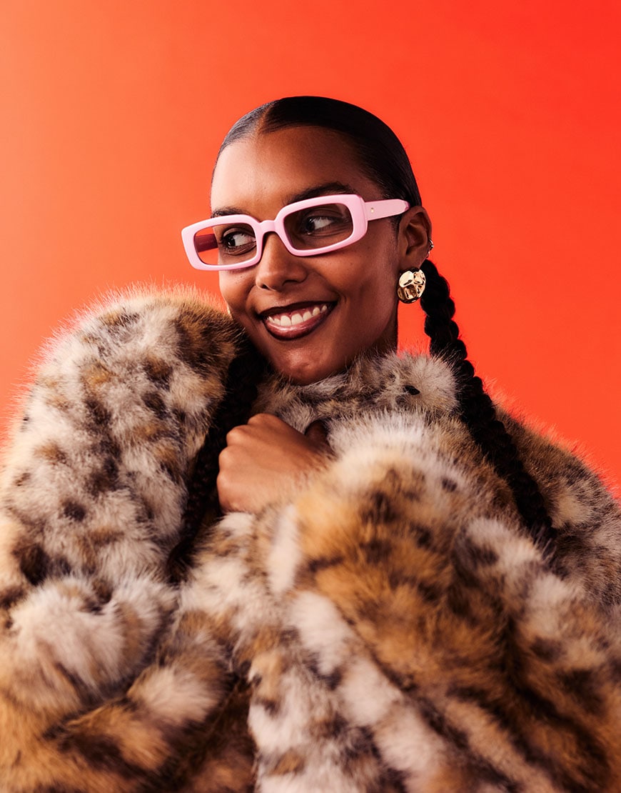 Woman wearing leopard print faux fur coat on orange background | ASOS Style Feed