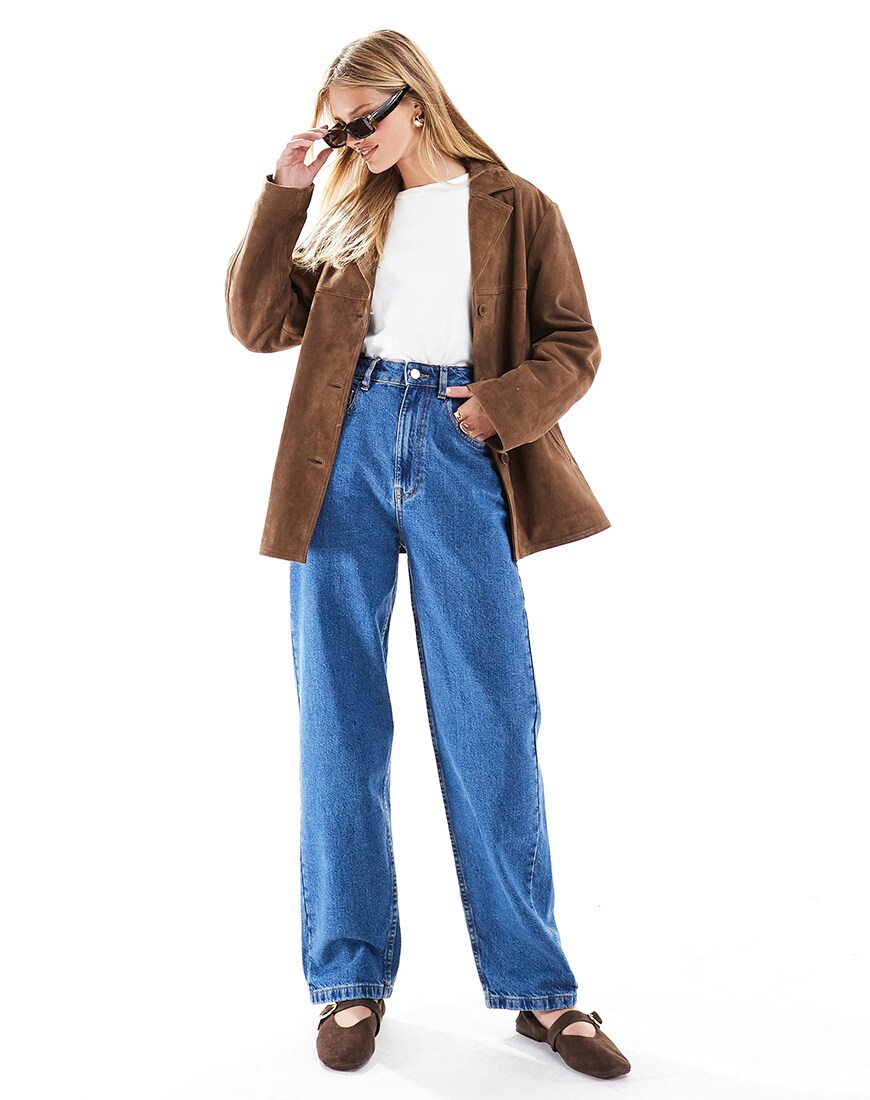 A woman wearing blue barrel jeans with a blazer | ASOS Style Feed