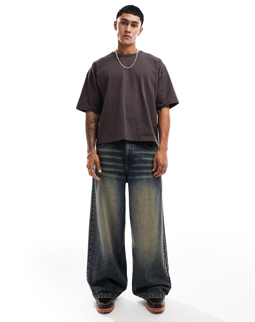A man wearing dark wash super baggy jeans with a grey T-shirt | ASOS Style Feed