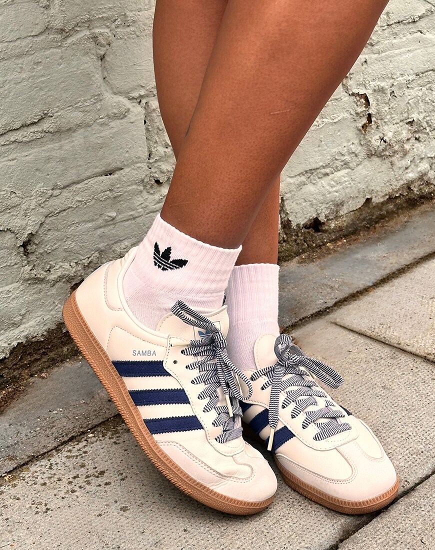 White adidas Samba with navy blue stripes
