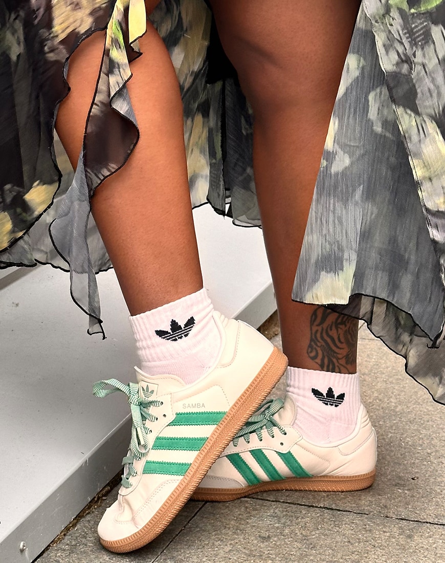 White Adidas Samba with green stripes
