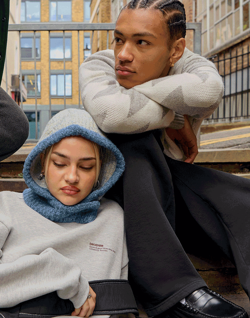 Model wearing black jeans, model wearing light blue jeans and male model wearing black joggers