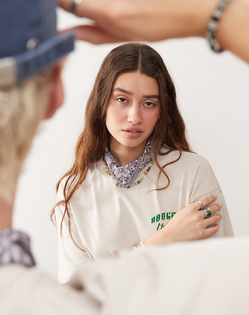 Model wearing the John B grey bandana over her neck