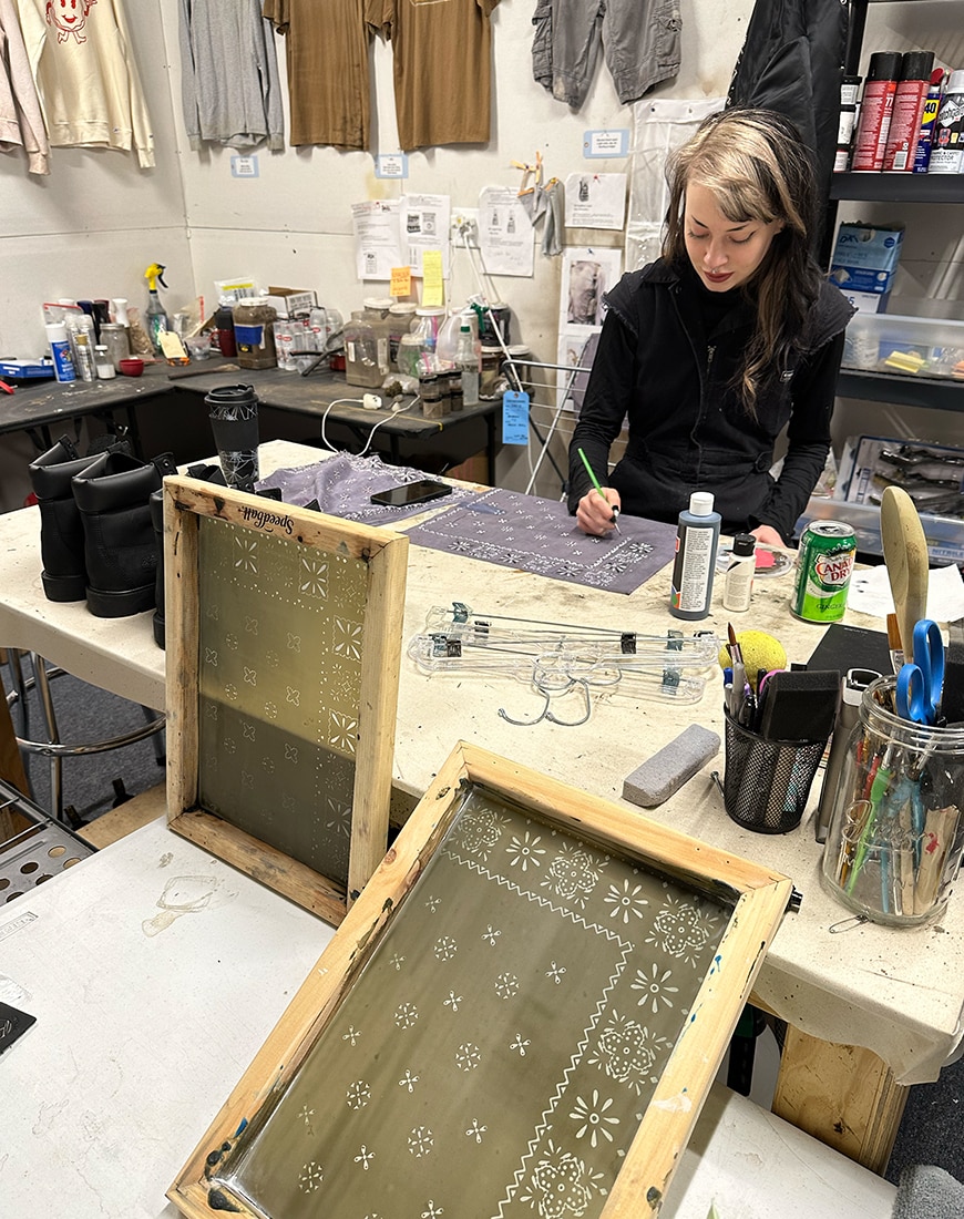 Grey Scott working on a grey bandana