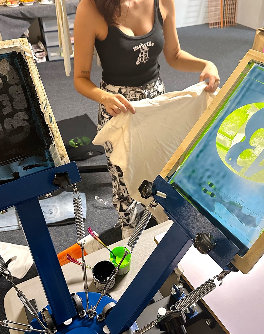 Woman showing the process of making custom clothing for Outer Banks