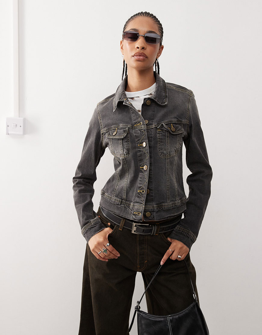 Black denim jacket styled with wide fit black jeans and Y2K sunglasses