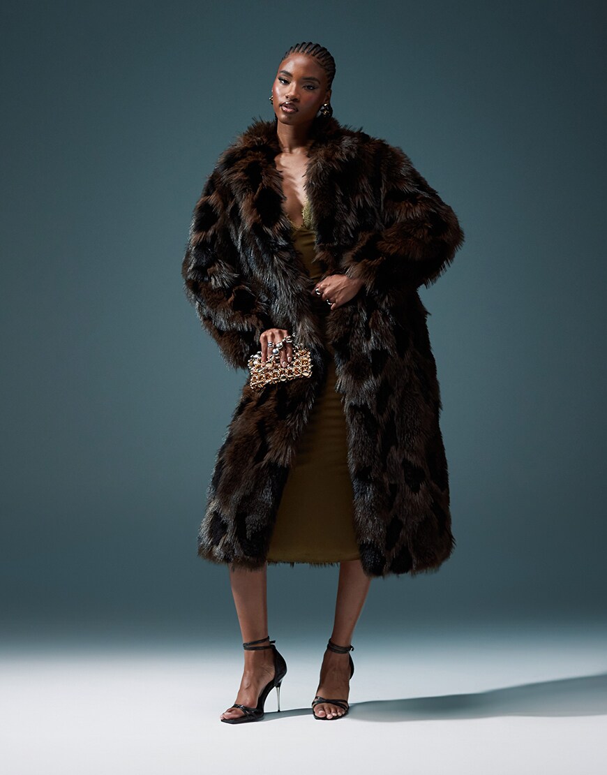 Model wearing dark brown shaggy long faux-fur coat