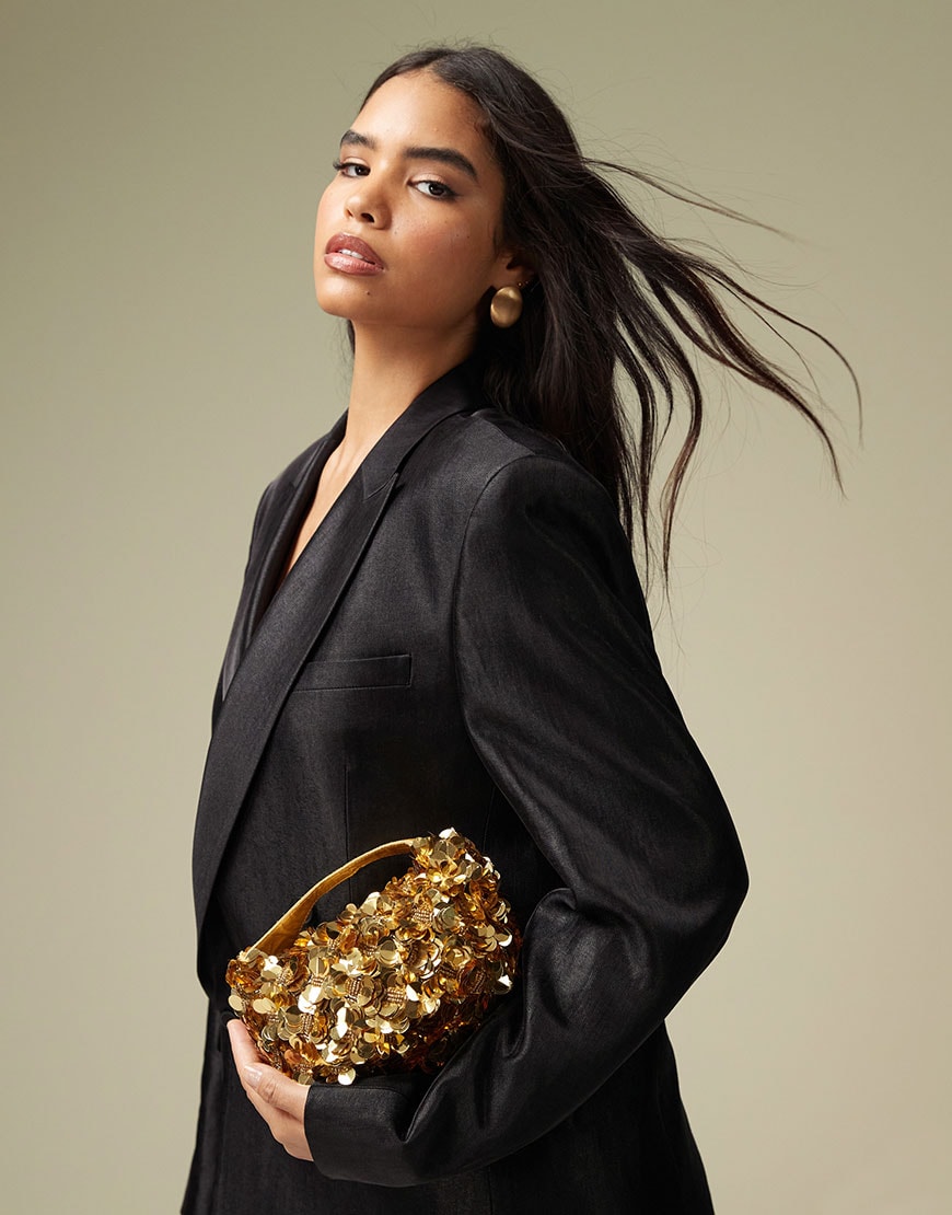 Model holding sequin bag | ASOS Style Feed