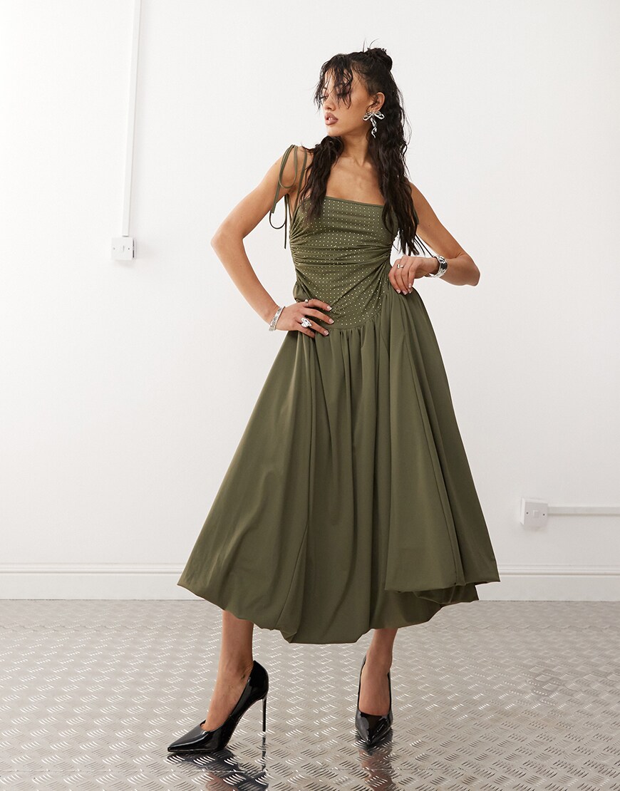 Model wearing green puffball maxi dress
