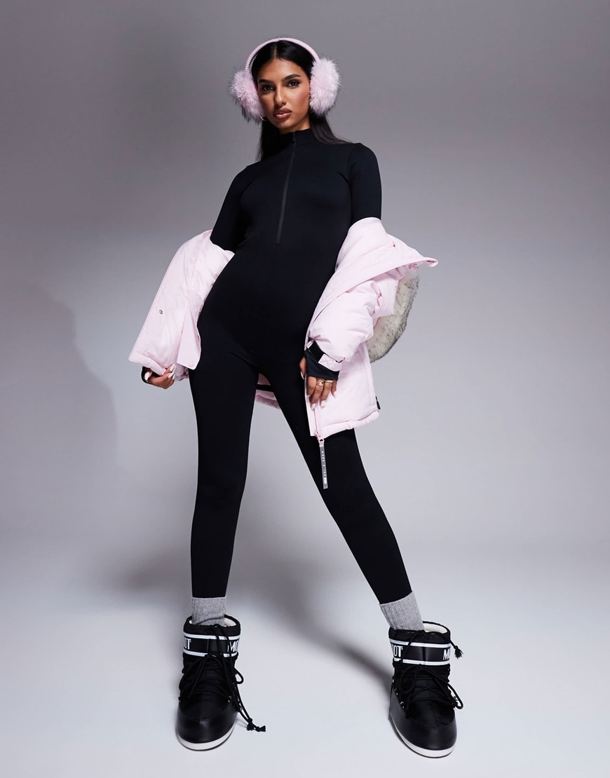 Woman wearing ski all-in-one