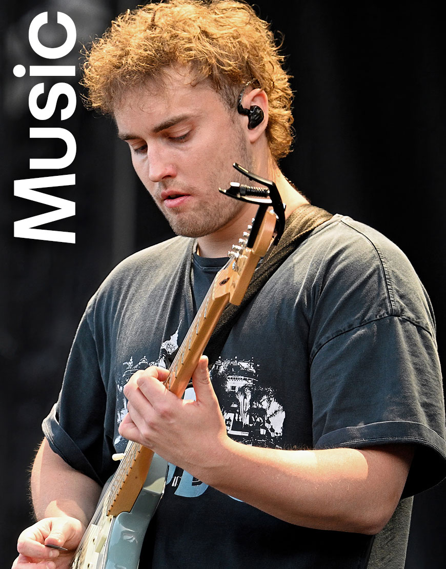 Sam Fender performing on stage