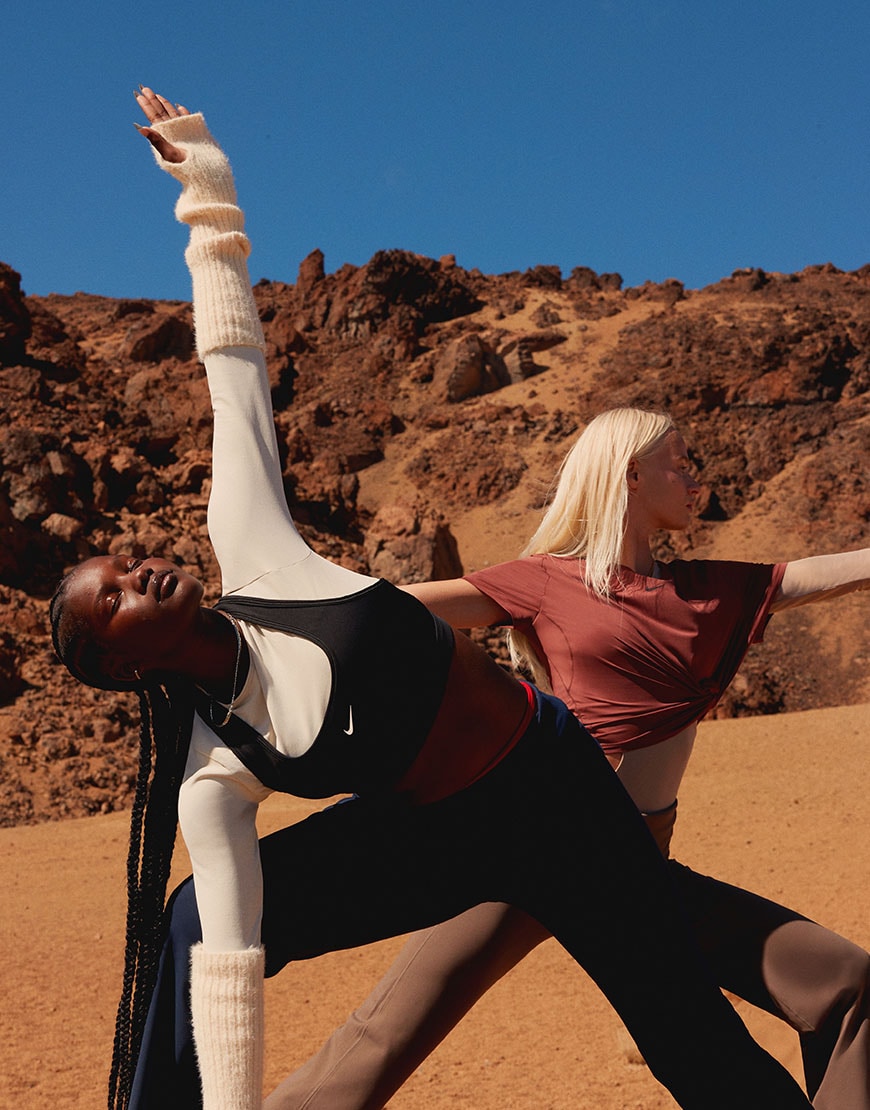 Model stretching in a yoga outfit from Nike | ASOS Style Feed