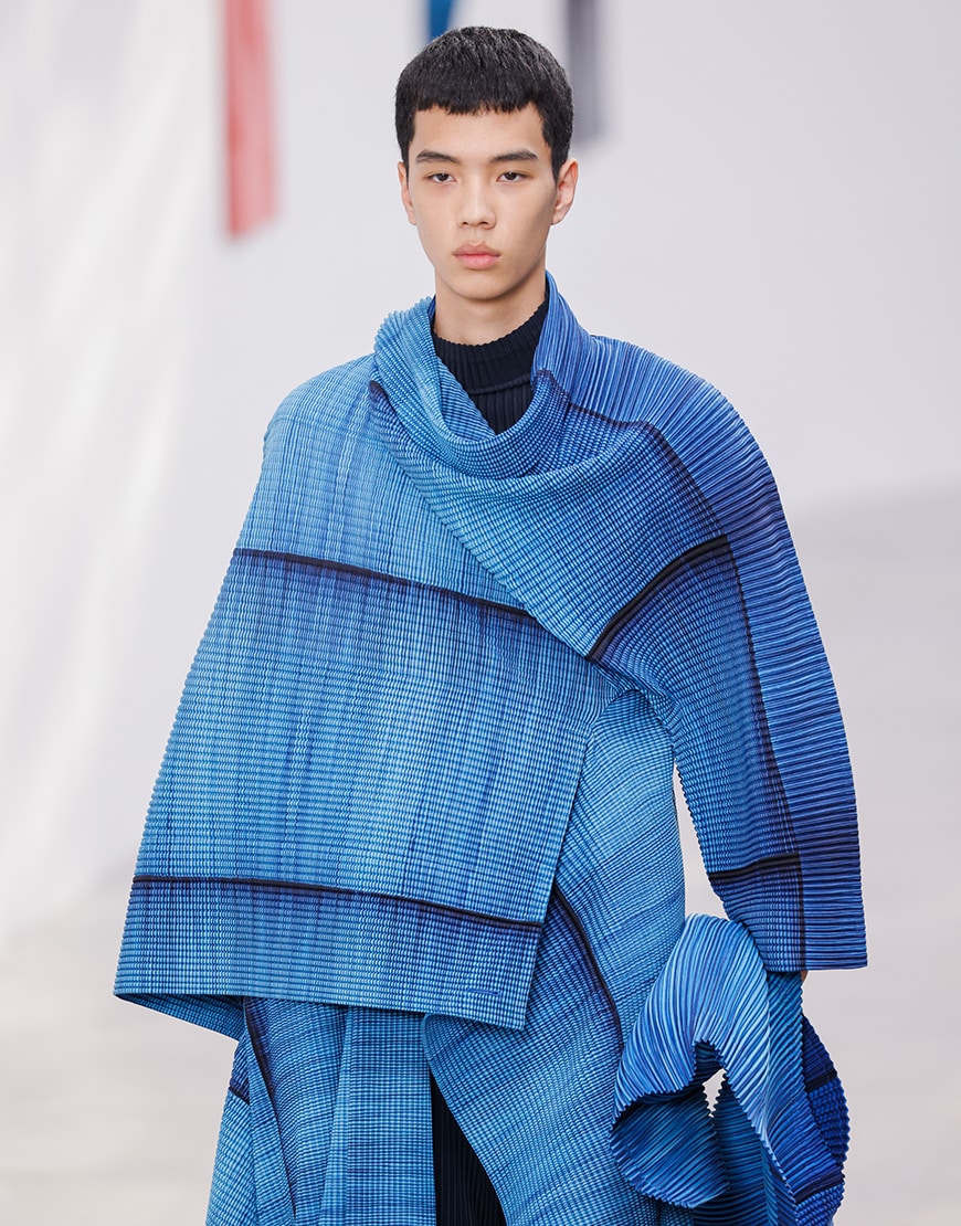 Model wearing blue Issey Miyake outfit at Fashion Week AW24