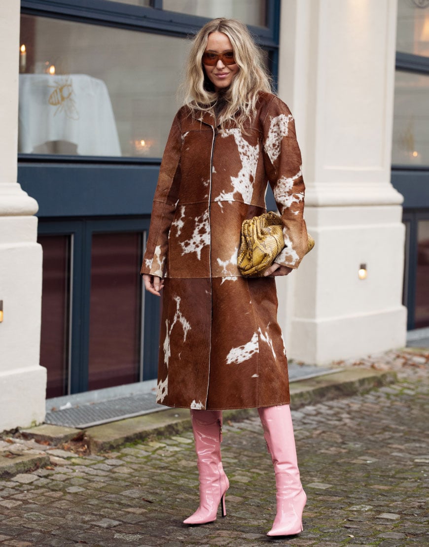 Woman Wearing Cow-Print Coat