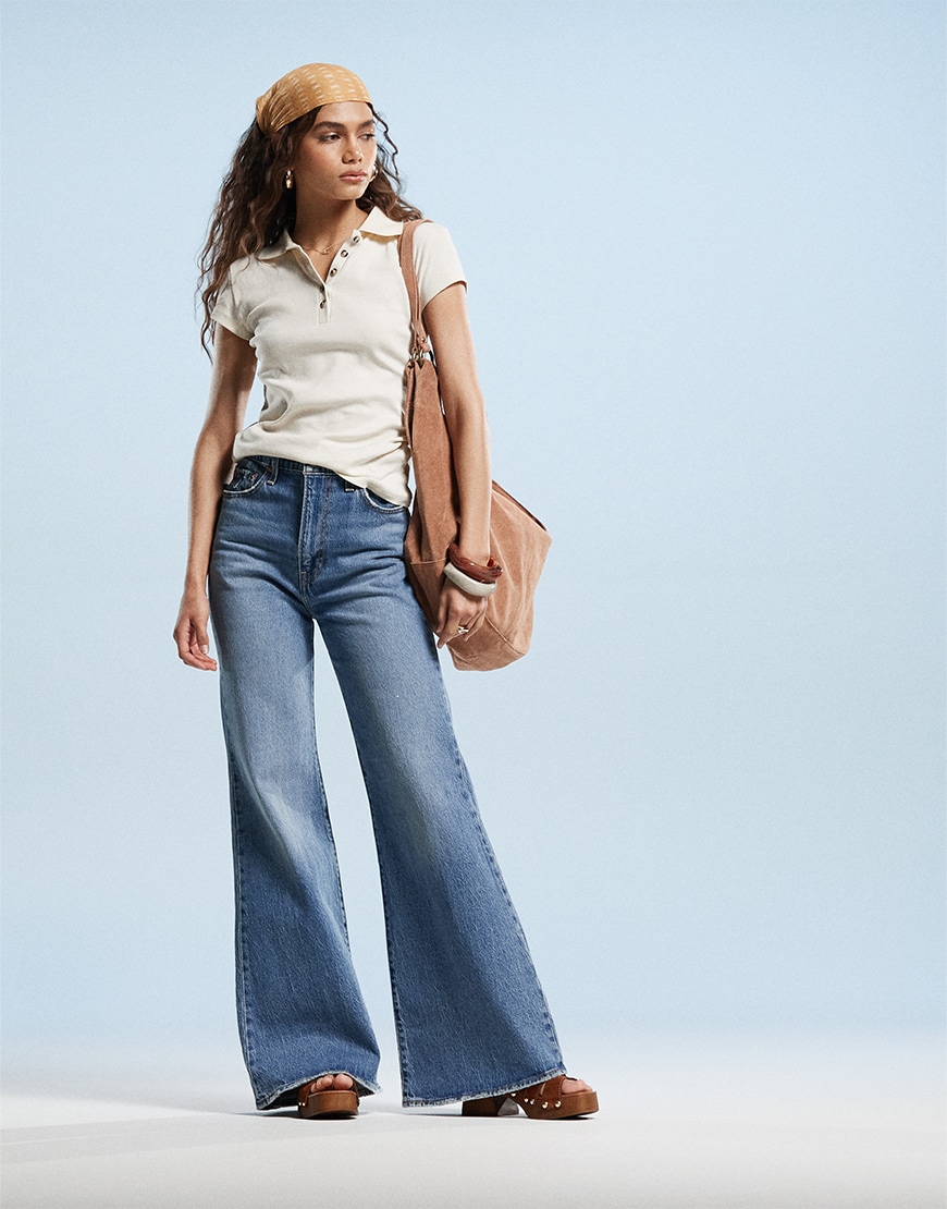 Model wearing flared jeans