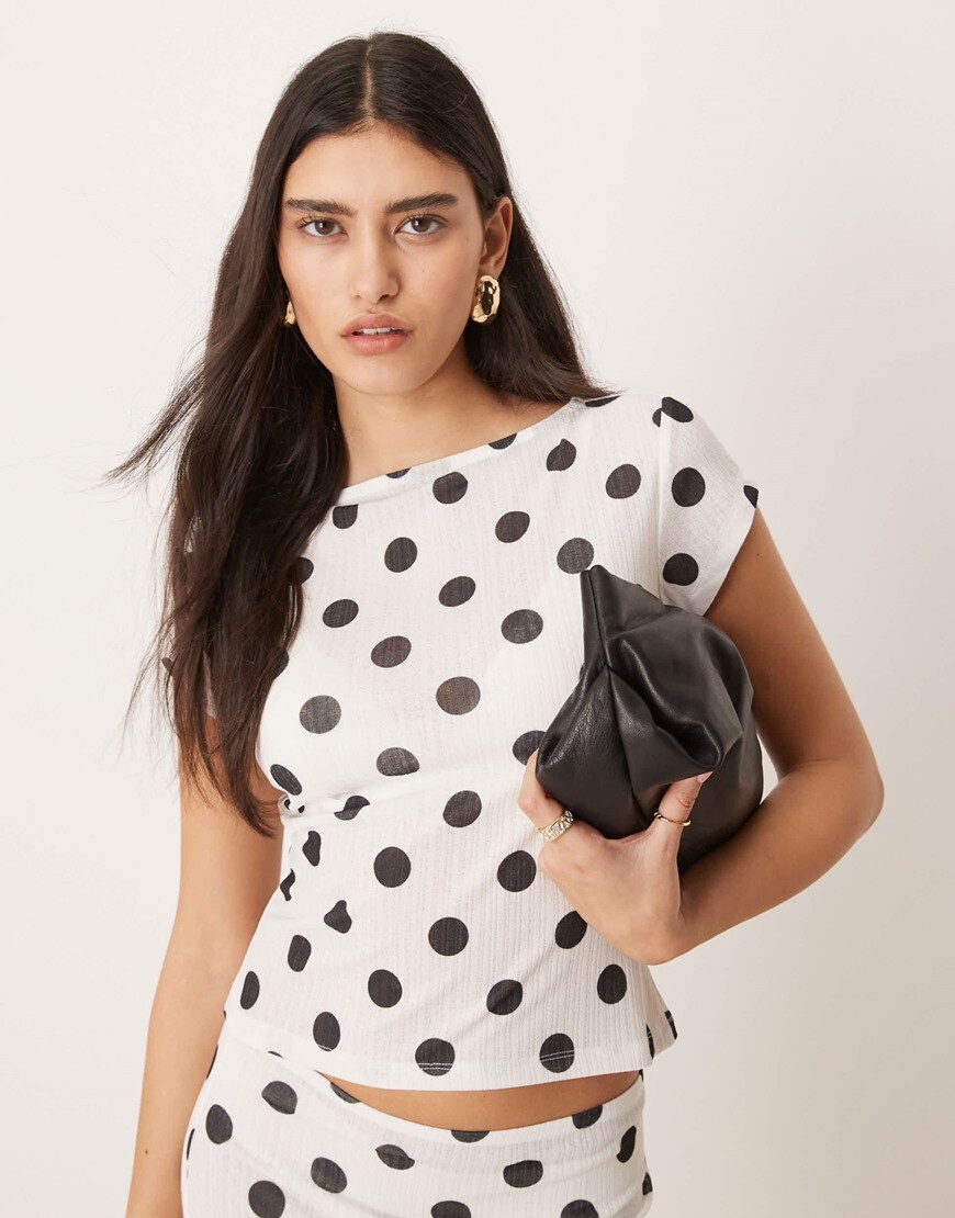 Model wearing polka dot top