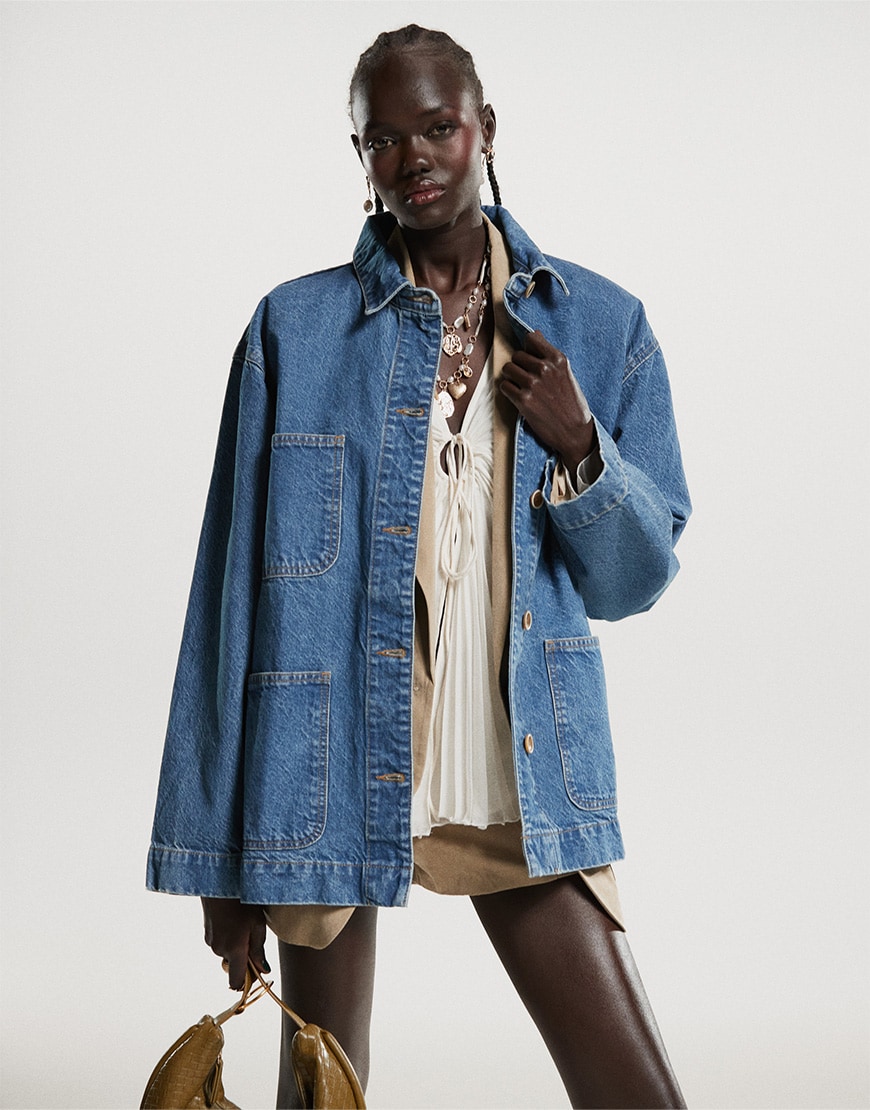Model wearing denim jacket over beige skirt suit | ASOS Style Feed