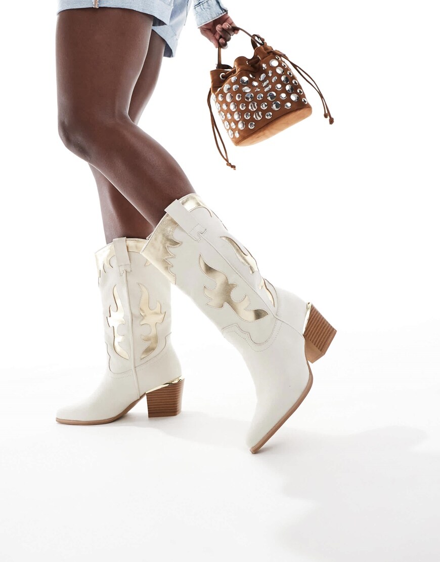 A model wearing white cowboy boots | ASOS Style Feed