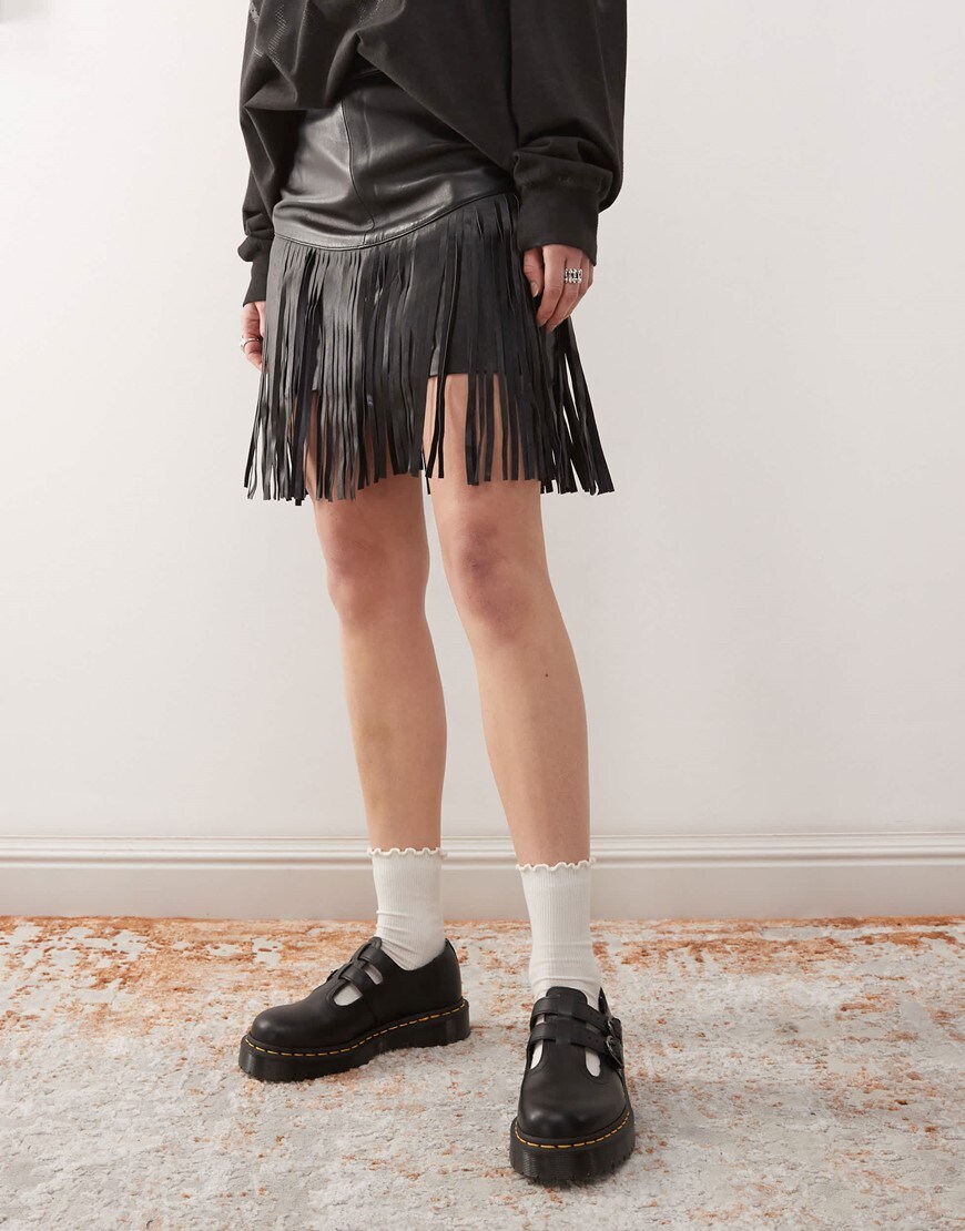 A model wearing a black fringed skirt | ASOS Style Feed