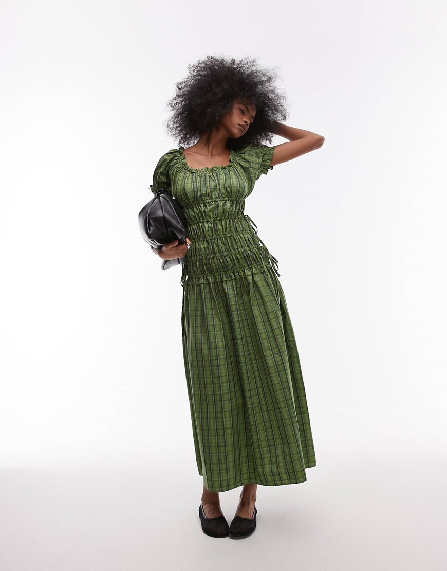 A model wearing a green ruched dress | ASOS Style Feed