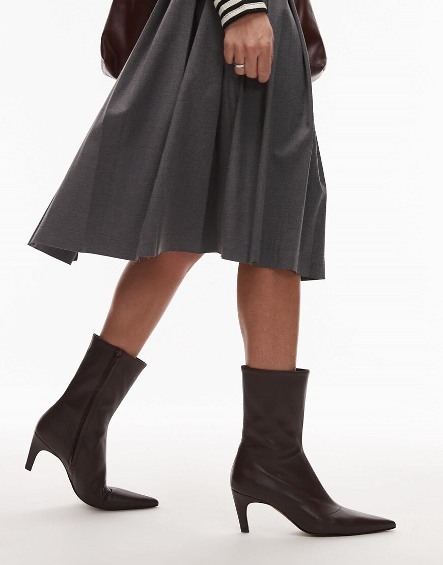 A model wearing burgundy ankle boots | ASOS Style Feed