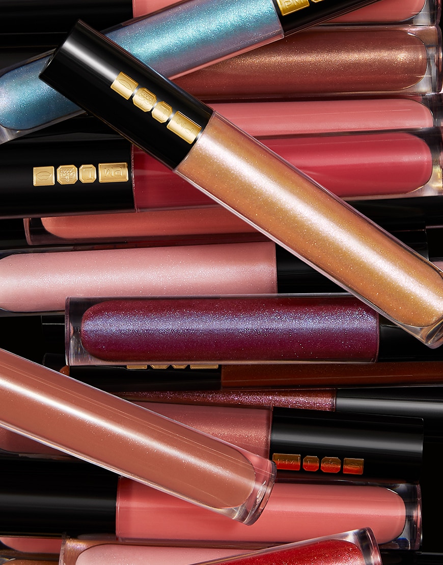 Several PAT McGRATH LABS lip glosses stacked above each other