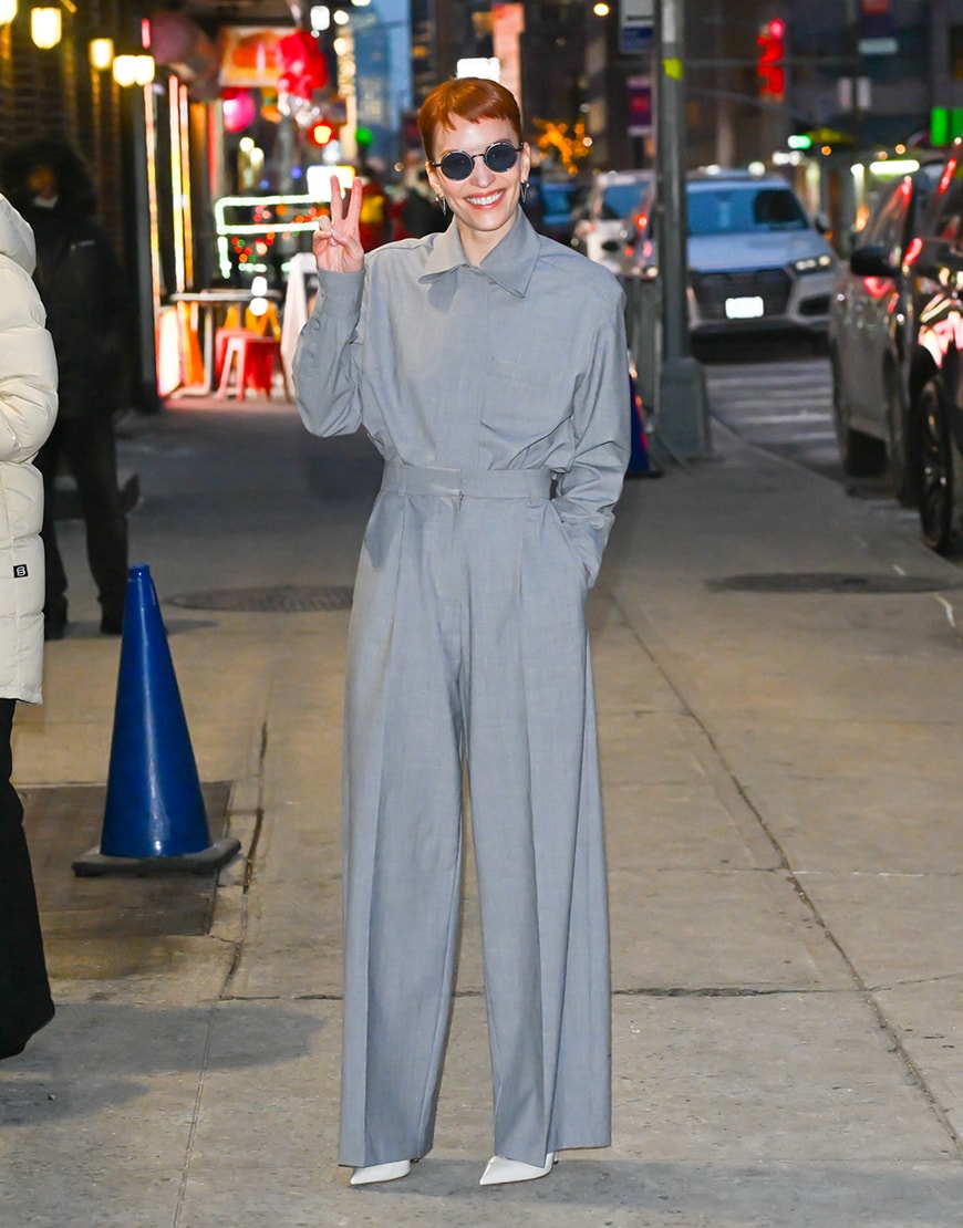 Britt Lower wearing a grey suit