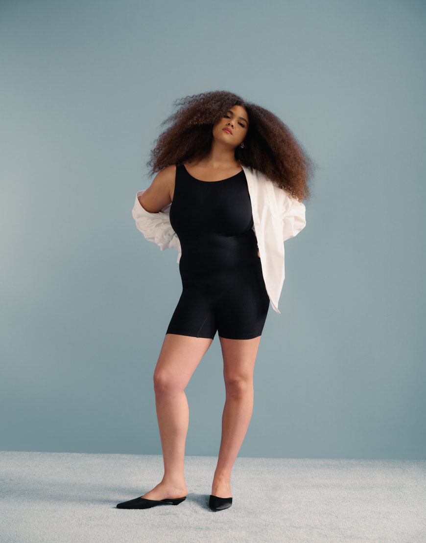 A model wearing a black Calvin Klein shapewear one piece | ASOS Style Feed